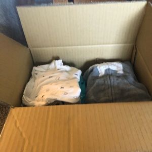 Box of baby boy clothes